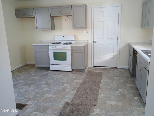 kitchen with gas range gas stove and gray cabinetry