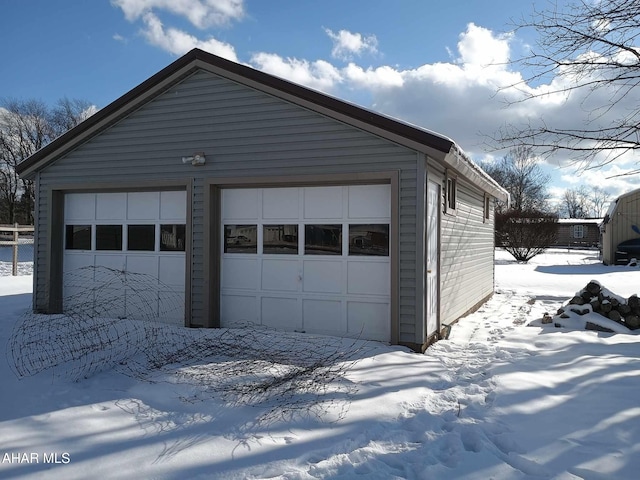 view of snow covered garage