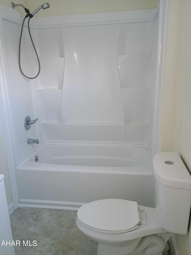 bathroom with toilet and washtub / shower combination