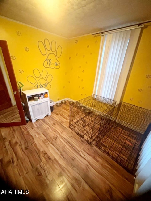 unfurnished bedroom featuring baseboards and light wood-style flooring