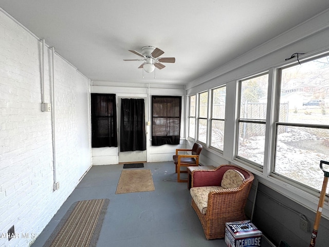 sunroom with a ceiling fan