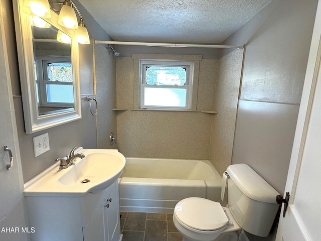 full bathroom with a textured ceiling, plenty of natural light, and vanity