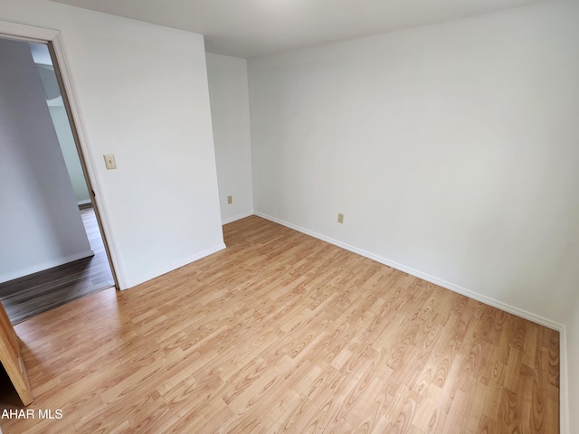 spare room featuring light hardwood / wood-style flooring