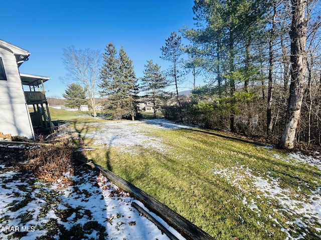 view of yard layered in snow