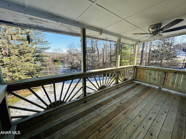 wooden deck featuring ceiling fan