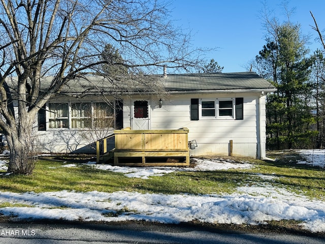 view of front of house with a wooden deck