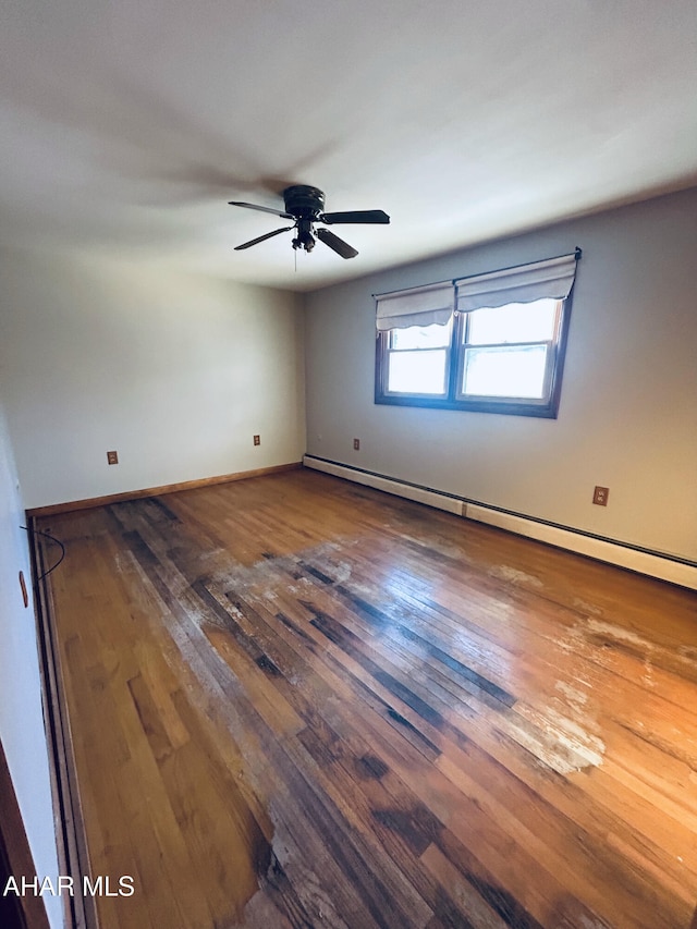 empty room featuring wood-type flooring, a baseboard radiator, and ceiling fan