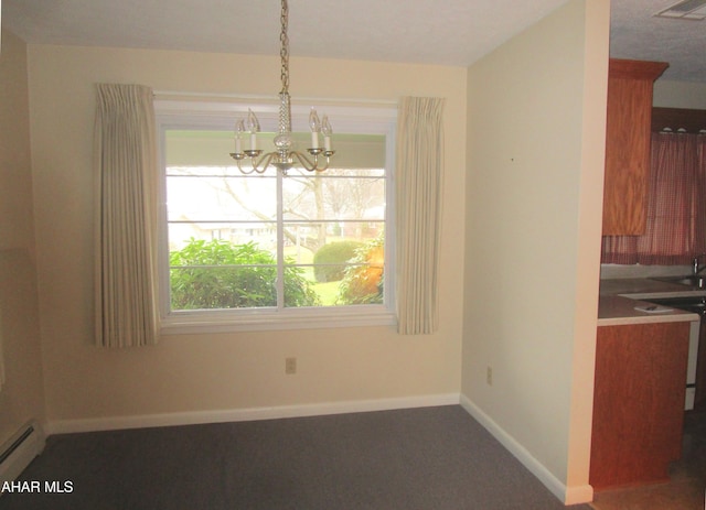 unfurnished dining area featuring baseboard heating and a chandelier