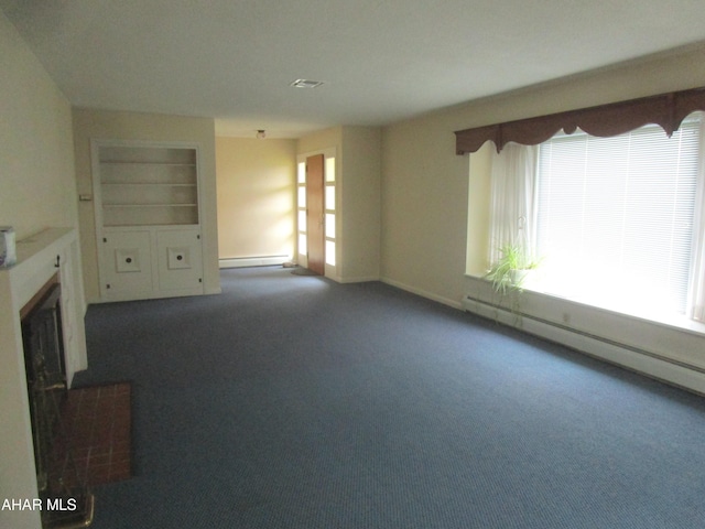 unfurnished living room with a fireplace, a baseboard radiator, and dark colored carpet