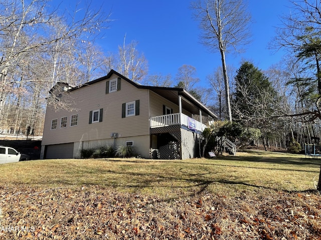 view of property exterior featuring a garage and a lawn