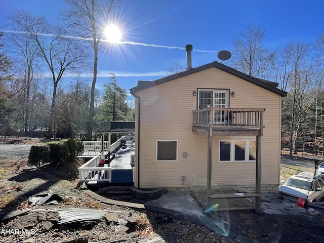 view of property exterior featuring a balcony