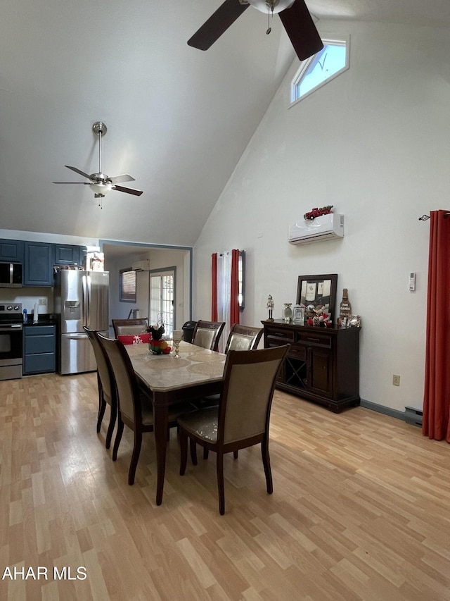 dining area featuring a wall mounted AC, lofted ceiling, and light wood-type flooring