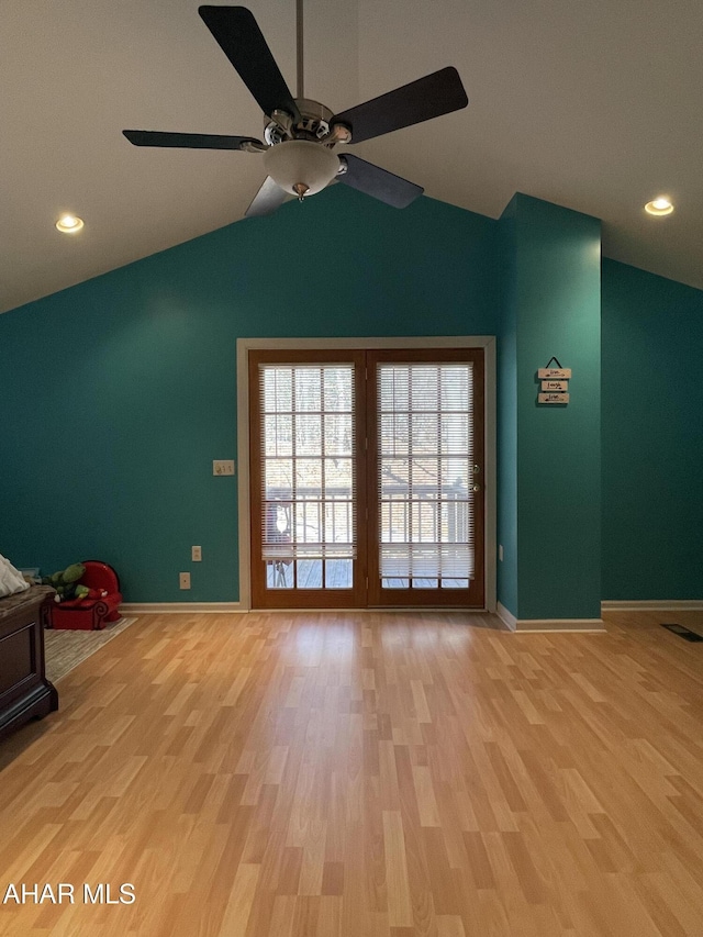 interior space with light hardwood / wood-style flooring, ceiling fan, and lofted ceiling