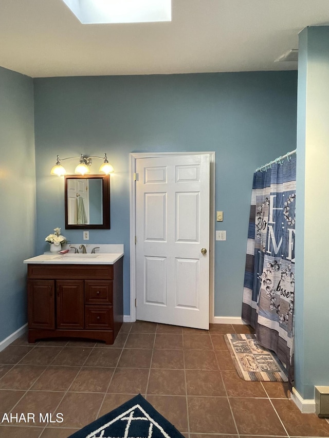 bathroom with vanity and tile patterned floors