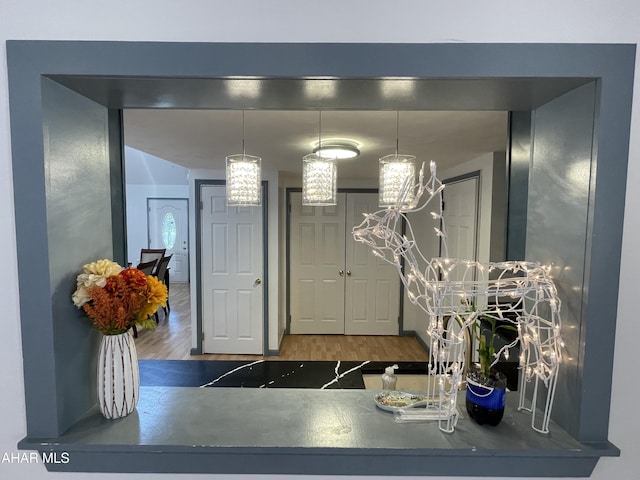 interior space with dark hardwood / wood-style flooring and a notable chandelier