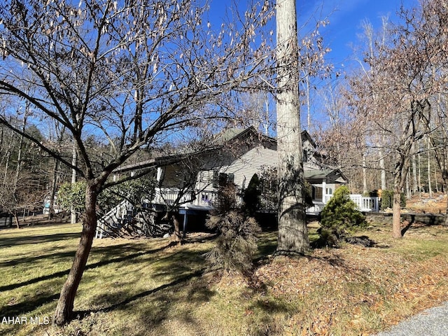 view of home's exterior featuring a yard