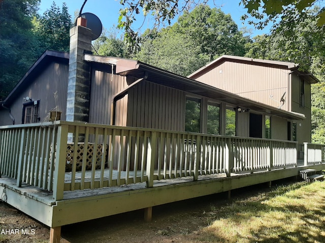 back of property with a wooden deck