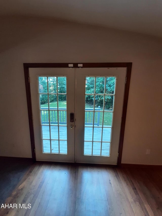 entryway with hardwood / wood-style flooring and french doors