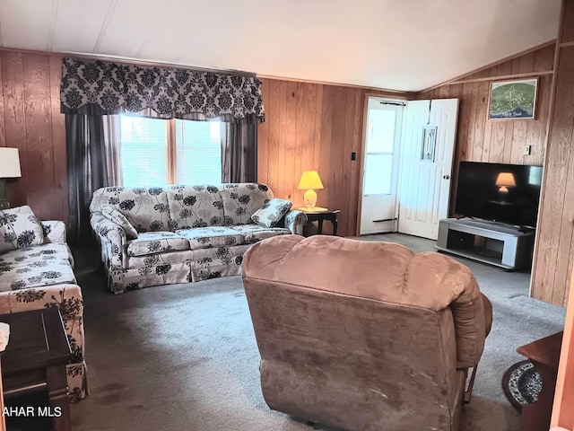 living room featuring lofted ceiling, carpet flooring, and wooden walls