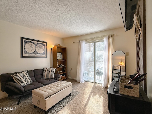 living room with a textured ceiling and carpet