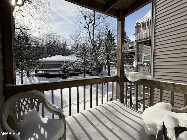 view of snow covered deck