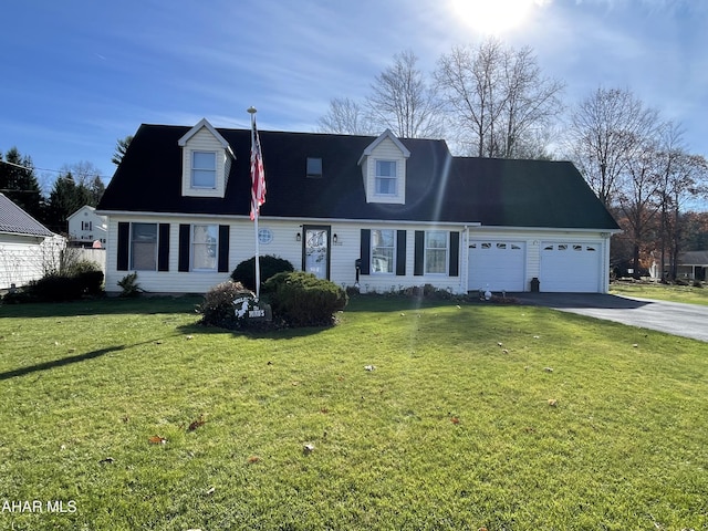 new england style home featuring a front yard and a garage