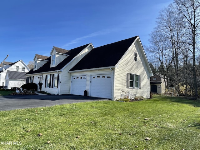 view of property exterior featuring a garage and a yard