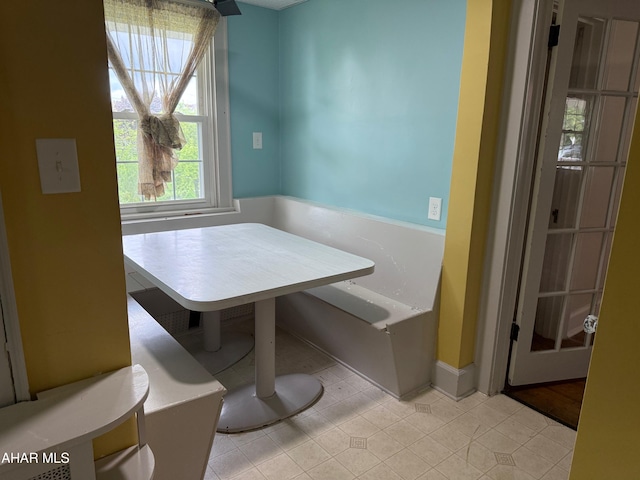 dining space with light tile patterned flooring
