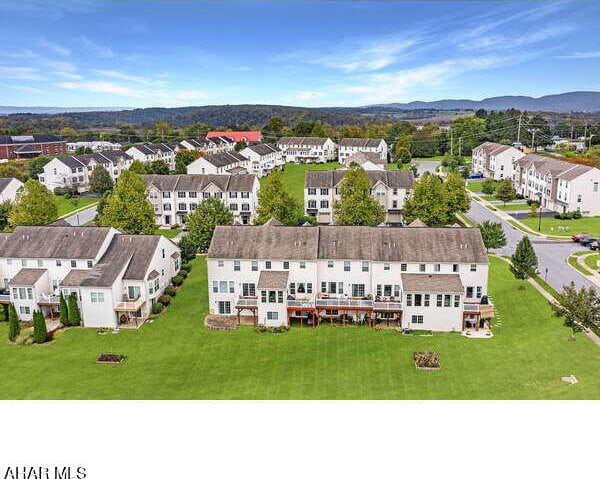 birds eye view of property featuring a mountain view and a residential view