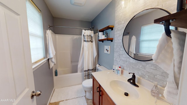 full bath with shower / bath combo, vanity, and toilet