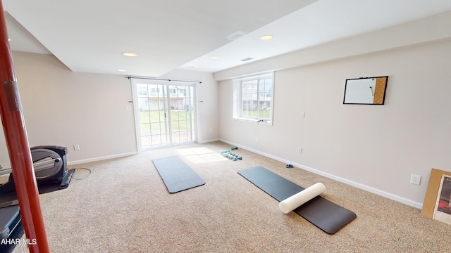 workout area featuring recessed lighting, carpet flooring, and baseboards