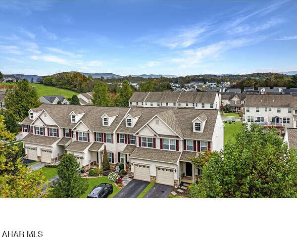 drone / aerial view with a residential view and a mountain view