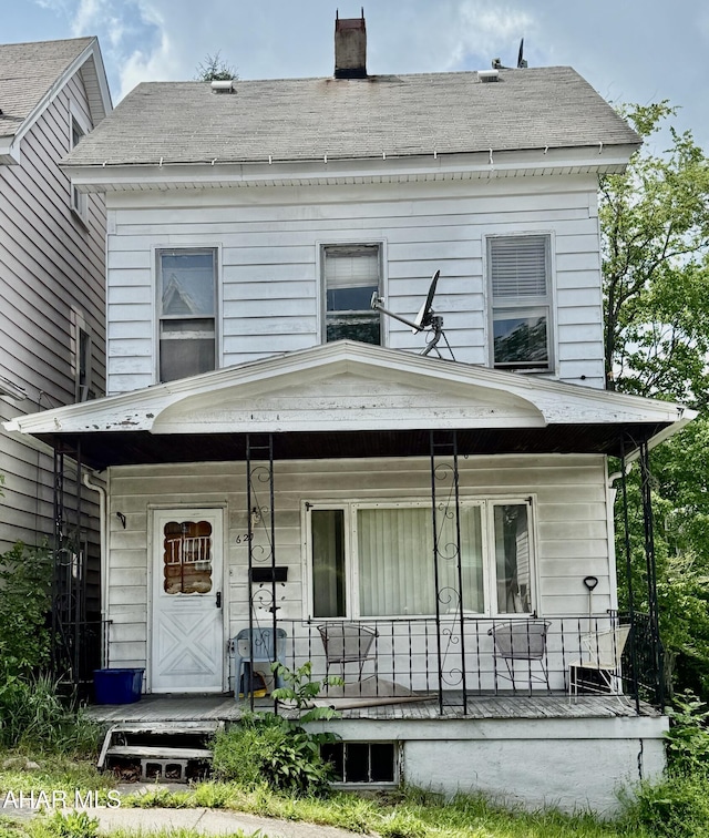 621 N 10th Ave, Altoona, PA 16601 - back of house with a porch, a chimney, and roof with shingles
