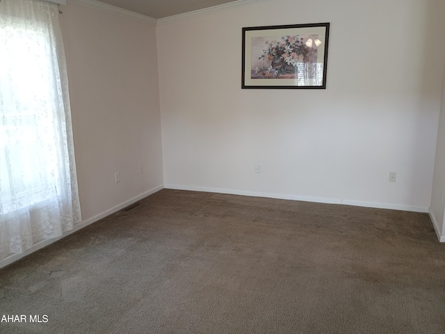 unfurnished room featuring carpet flooring and crown molding