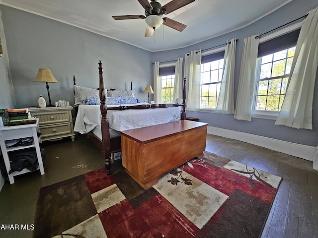 bedroom featuring wood-type flooring, a ceiling fan, baseboards, and ornamental molding