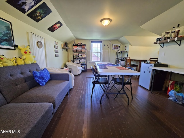 playroom featuring wood-type flooring and vaulted ceiling