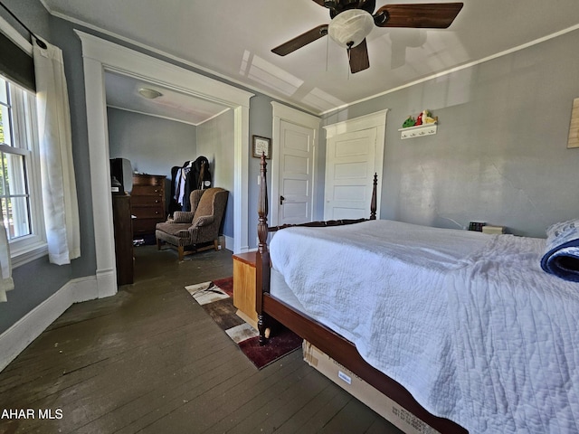 bedroom with baseboards, wood-type flooring, and a ceiling fan
