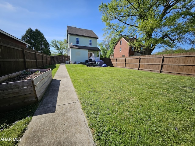 view of yard with a fenced backyard