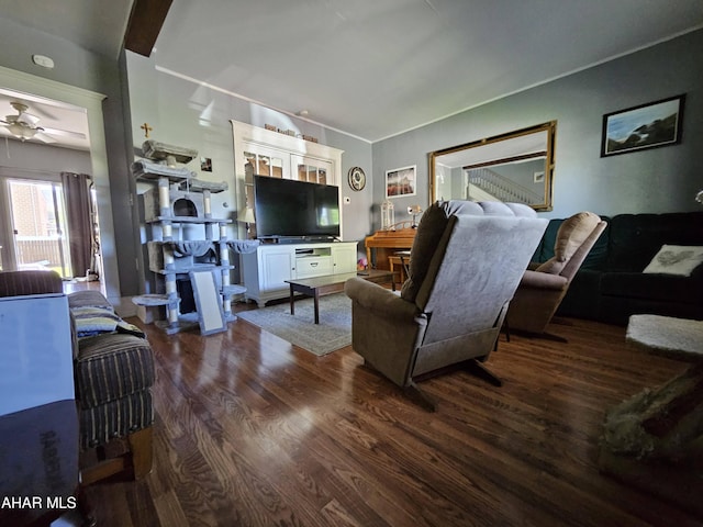 living area with ceiling fan and dark wood-type flooring