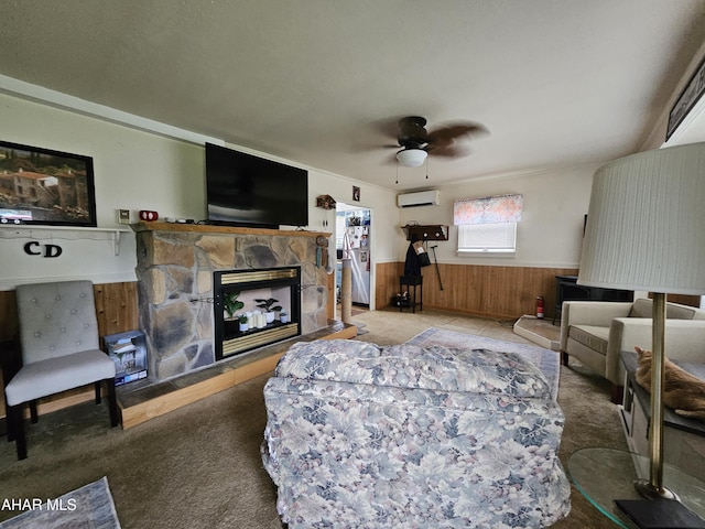 2802 Elm St, Altoona, PA 16601 - living room with a wall unit AC, a wainscoted wall, a stone fireplace, carpet flooring, and ceiling fan