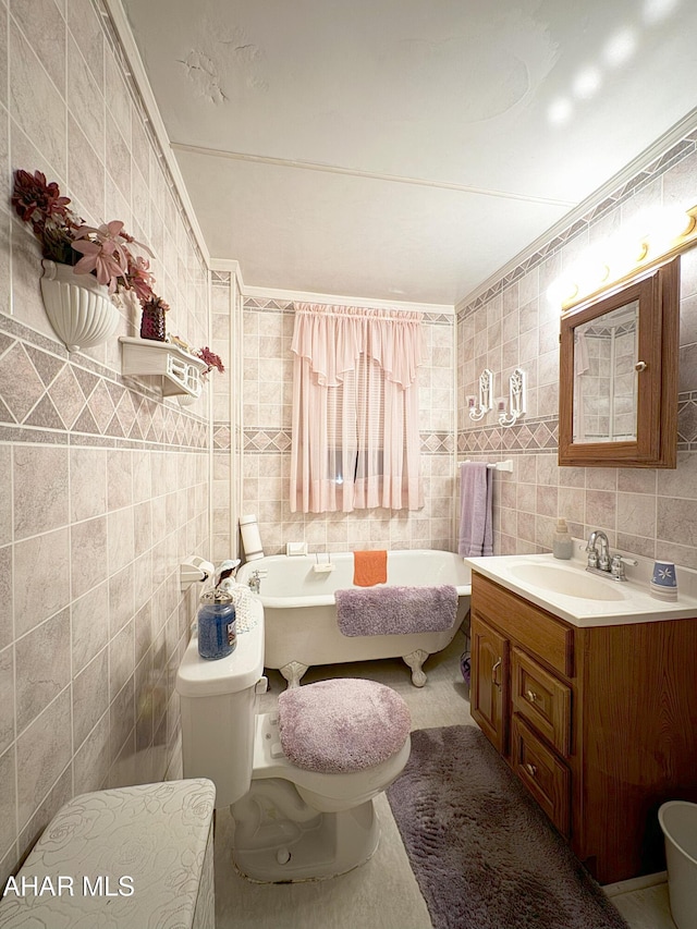 bathroom with tile walls, ornamental molding, and a bathing tub