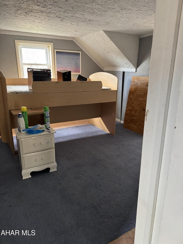 bonus room featuring a textured ceiling, carpet flooring, and lofted ceiling