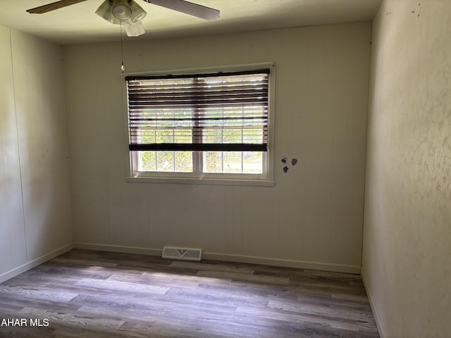 897 Burns Ave, Altoona, PA 16601 - spare room featuring wood finished floors, a ceiling fan, and baseboards