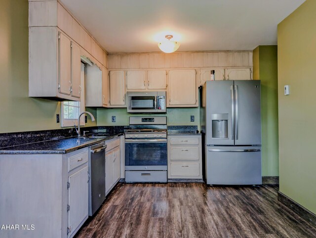 151 Rio Grande Rd, Clearville, PA 15535 - kitchen with appliances with stainless steel finishes, a sink, dark wood-type flooring, and dark stone countertops
