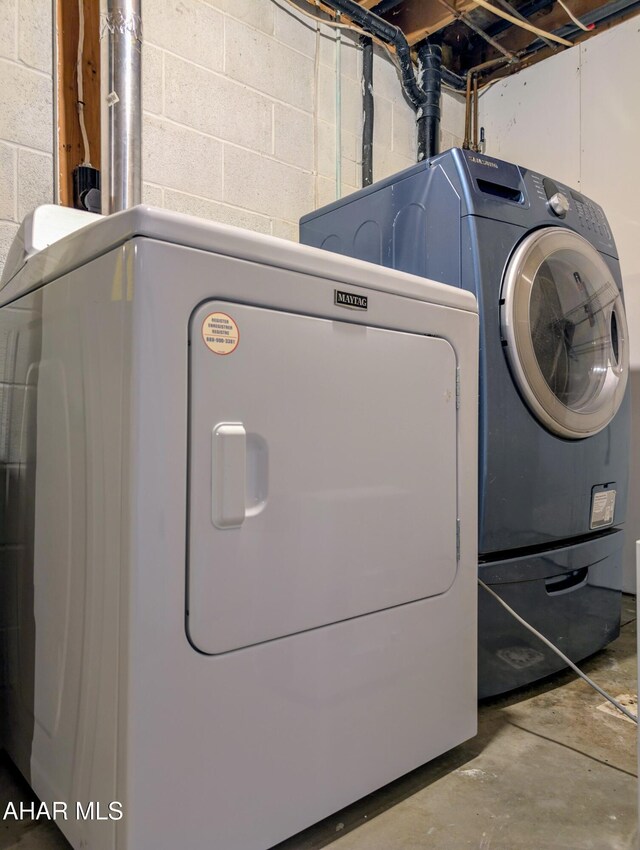 151 Rio Grande Rd, Clearville, PA 15535 - laundry room featuring concrete block wall and washing machine and clothes dryer