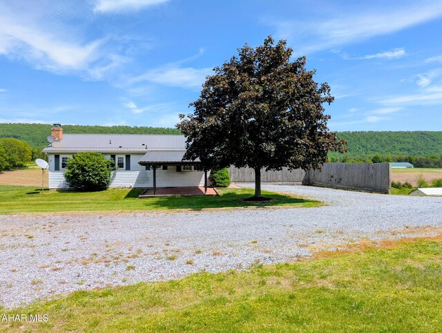 151 Rio Grande Rd, Clearville, PA 15535 - view of front of property with a chimney, driveway, and metal roof