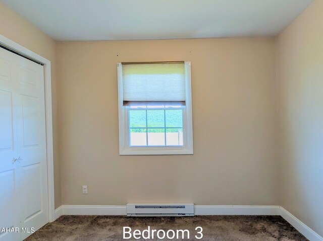 151 Rio Grande Rd, Clearville, PA 15535 - unfurnished bedroom with baseboard heating, carpet floors, and baseboards