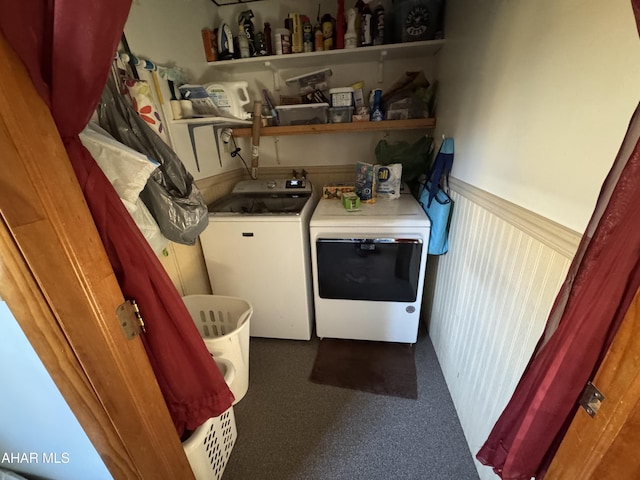 washroom with dark colored carpet and washing machine and clothes dryer