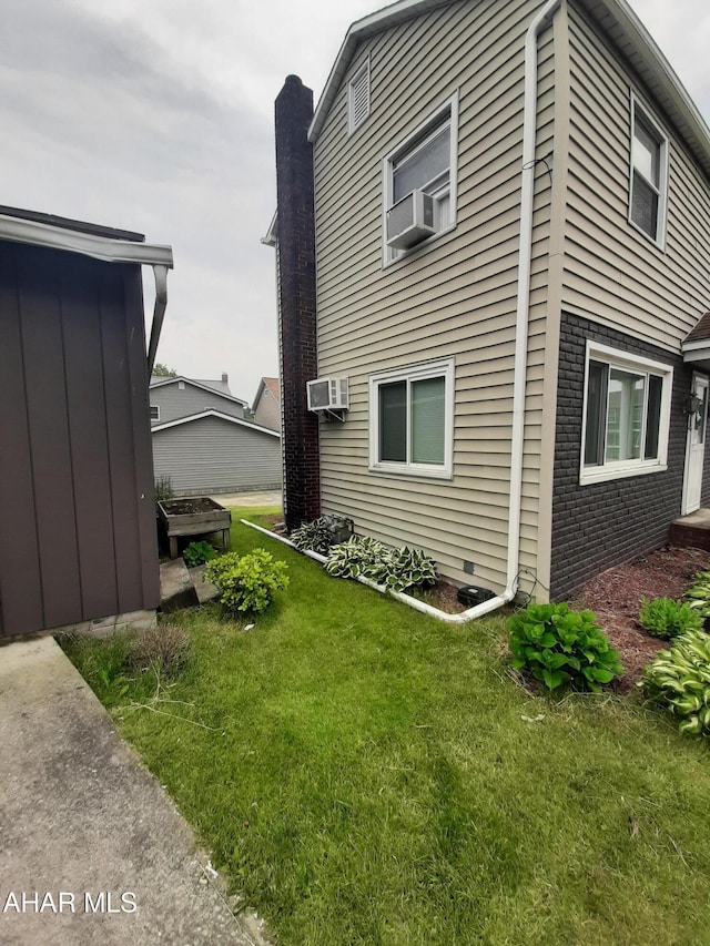 304 Forest St, Gallitzin, PA 16641 - view of side of home with brick siding, a lawn, and cooling unit