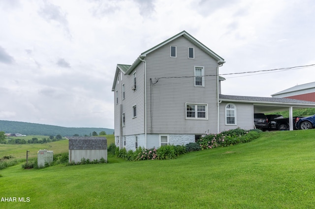 7241 Morgans Rd, Huntingdon, PA 16652 - rear view of house with a yard and a carport